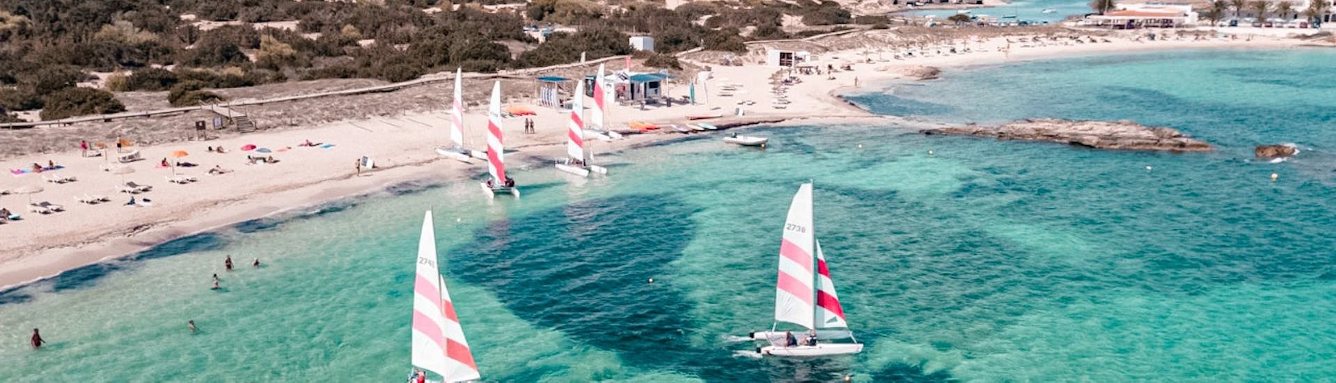 Aerial view of the bay of Es Pujols where there are several sailing boats for rent by Wet4Fun Formentera for up to 53 people without license.