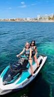 Dos amigas en Ibiza disfrutando de un circuito en moto de agua desde Playa d' en Bossa con Enjoy Watersports Ibiza.