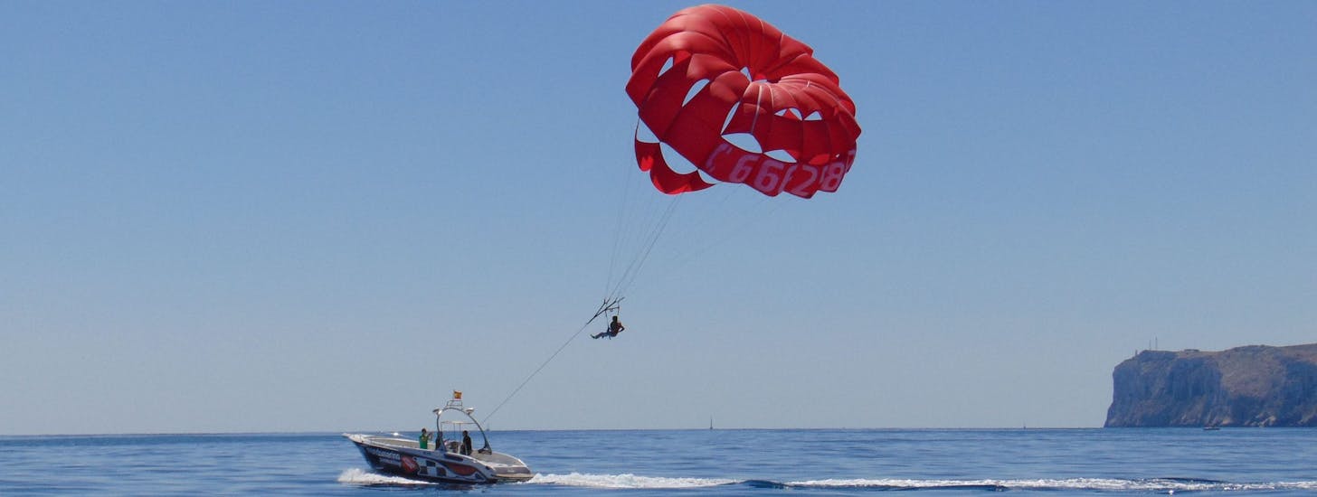 Aerial views of a parasailing flight in Denia with Mundo Marino Denia during a boat trip.