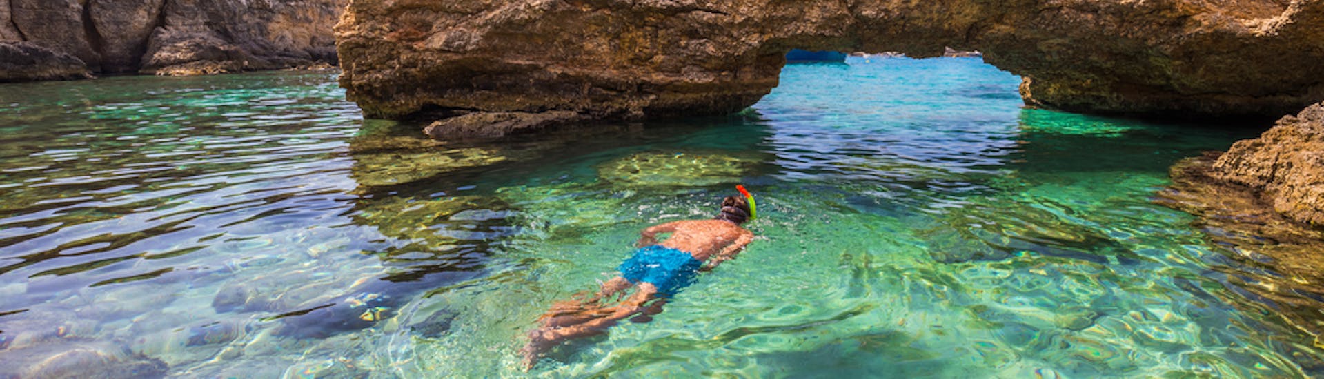 A guy enjoying the Snorkeling Trip from St. Julian's to Il-Hofriet & St. Peter’s Pool with Sun & Fun Watersports Malta.