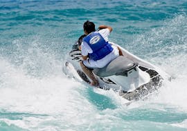 A guy driving a jet Ski during the Jet Ski Safari from St. Julian's to St.Paul’s Bay or Il-Hofriet with Sun & Fun Watersports Malta.