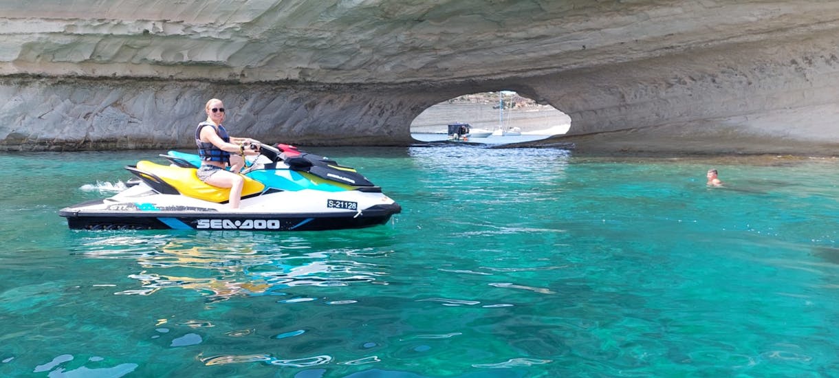 A woman driving a Jet Ski during the Jet Ski Safari from St. Julian's to St.Paul’s Bay or Il-Hofriet with Sun & Fun Watersports Malta.