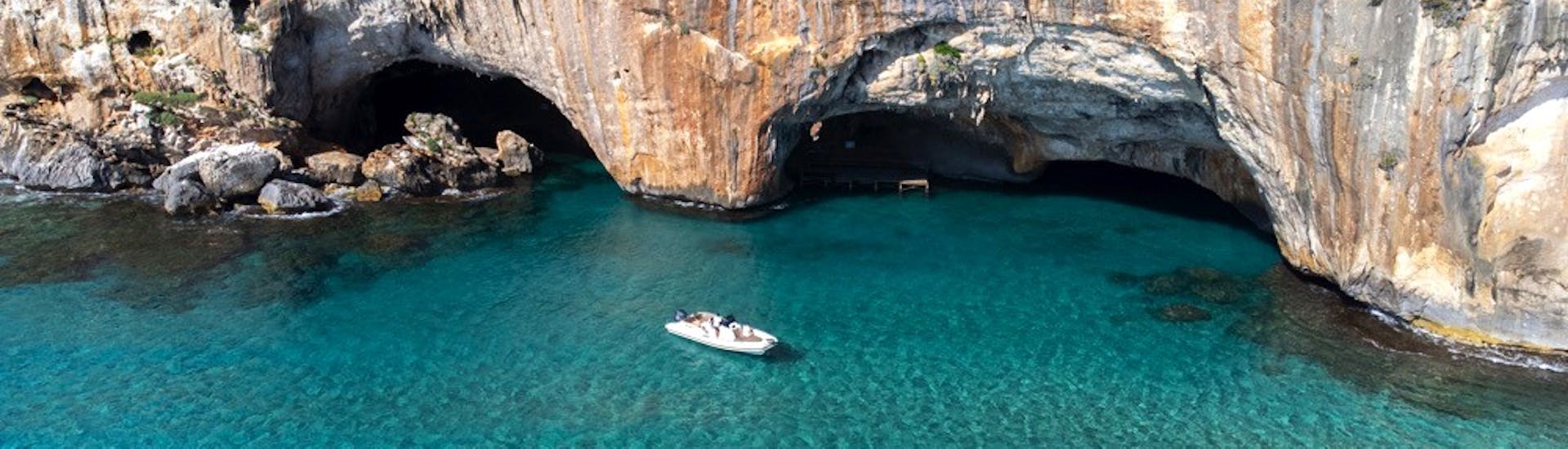 The RIB boat from Nuovo Consorzio Trasporti Marittimi is navigating during the RIB Boat Trip in the Gulf of Orosei from Cala Gonone with Swimming Stops.