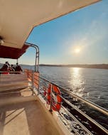 The sunset illuminates the boat during the Sunset Boat Trip to St Paul's Islands with Swimming at the Crystal Lagoon with Oh Yeah Malta.