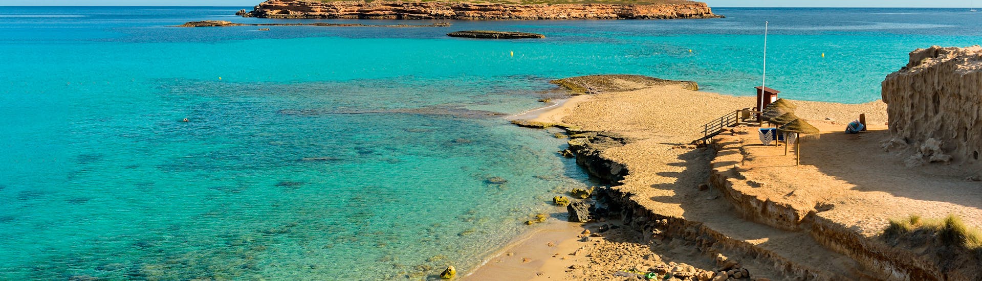 The beach where you will be able to swim during the Glass-Bottom Catamaran Trip to Cala Salada with Swimming & Snorkeling with Capitan Nemo Ibiza.