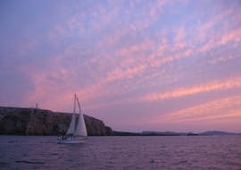 One of the Katayak Menorca boats during a sunset sailing boat trip from Fornells with open bar.