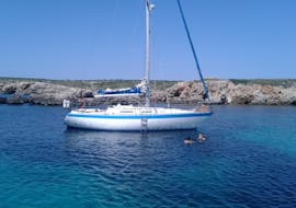 One of the boats of the Katayak Menorca during a private sailing trip from Fornells in the north of Menorca with open bar.