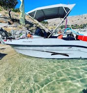 View of the boat during the Private Boat Trip to Anthony Quinn's Bay & Traganou Caves with Snorkeling from Lindos Rental Boats.