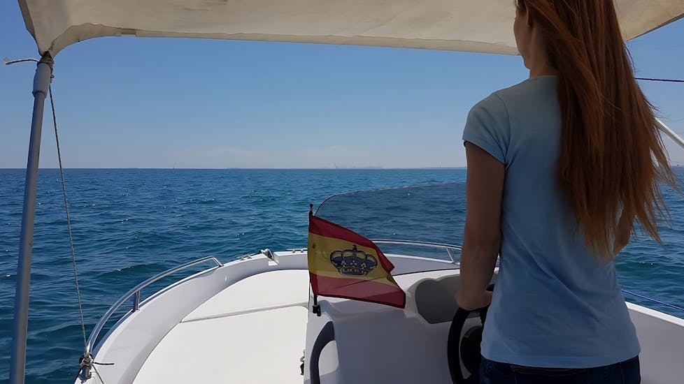 A girl during a boat Rental in La Pobla de Farnals, Valencia (up to 5 people) without Licence with  with Low Cost Charter La Pobla de Farnals.
