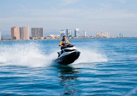Jet ski navigating in the Mediterranean Sea from Valencia from La Pobla de Farnals with Licence from Low Cost Charter Pobla de Farnals.