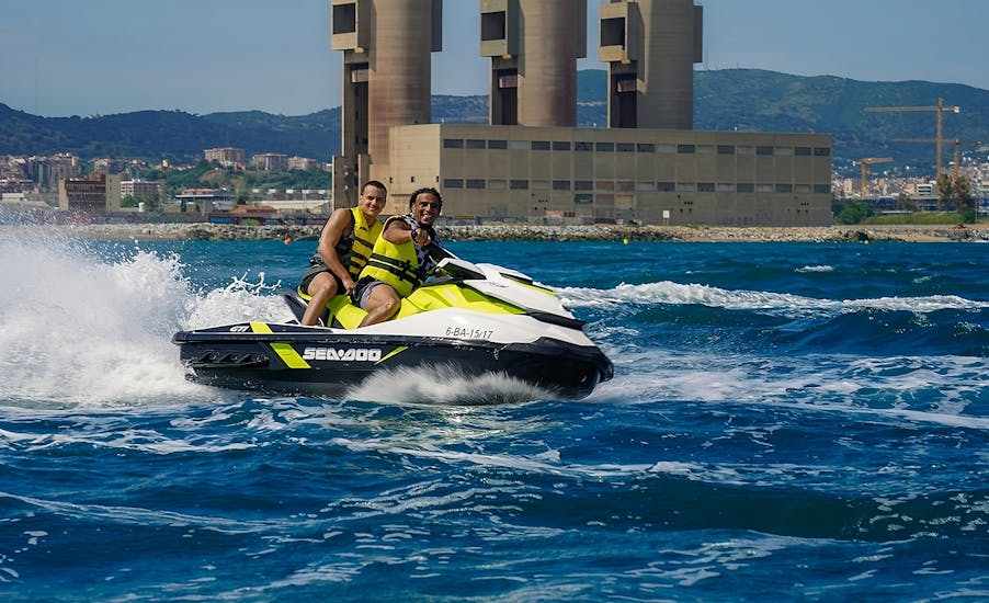 Two friends during a jet ski safari from Badalona to Mataró in Barcelona with Sea Riders Badalona.