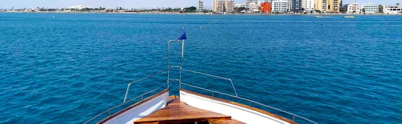 People enjoying the view during the Glass-Bottom Boat Trip to Zenobia Shipwreck & Mackenzie Beach with Snorkeling from Larnaca Napa Sea Cruises.
