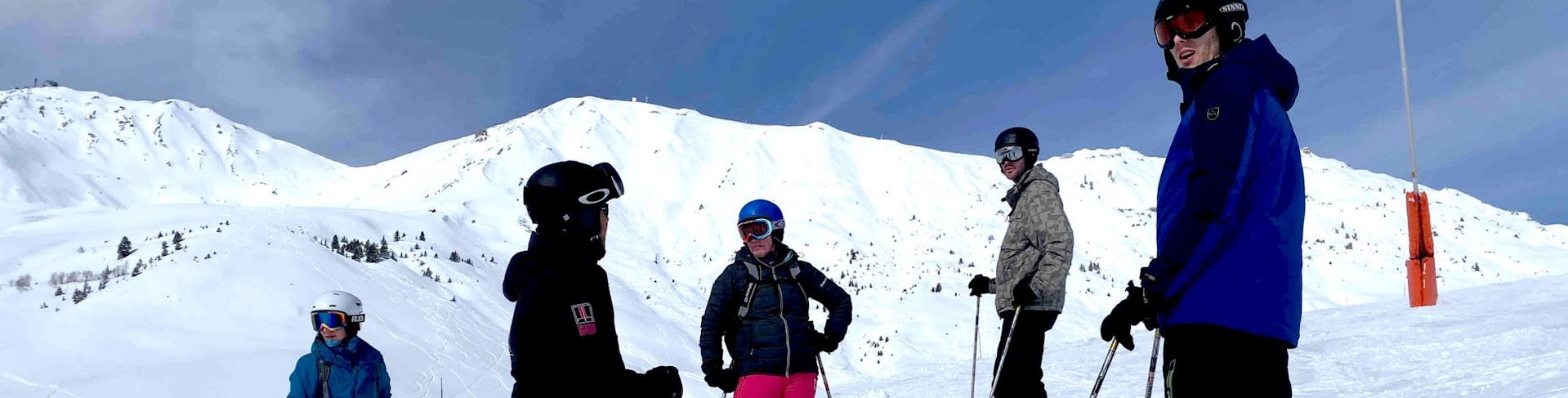 A group doing Private Ski Lessons for Adults - Plagne Centre Ski School ELPRO La Plagne.