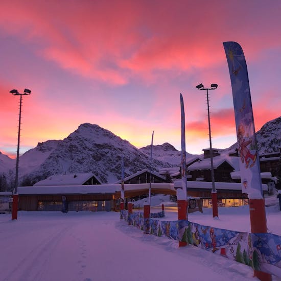 Pink sky over Arosa during Private Snowboarding Lessons for Kids ( from 7 y.) & Adults of All Levels.