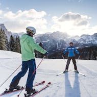 Adult skier with their instructor during Adults Ski Lessons for All Levels - DOLOMITES from Scuola di Sci e Snowboard Dolomites Armentarola .