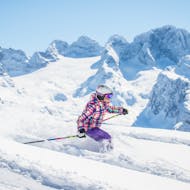 A kid skiing on the slopes during her Private Ski Lessons for Kids (from 6 y.) for Skiers with Experience from Franz Quehenberger.