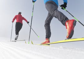 Two cross country skiers enjoying their Private Cross Country Skiing Lessons for First Timers from Private Ski School Höll.