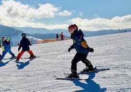 Three kids on the slopes during their Private Ski Lessons for Kids of All Levels from Hansi Kienle.
