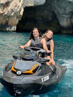 Two girls are doing a Jet Ski Safari from St Thomas Bay to the Blue Grotto & St. Peter's Pool from SIPS Watersports Malta.