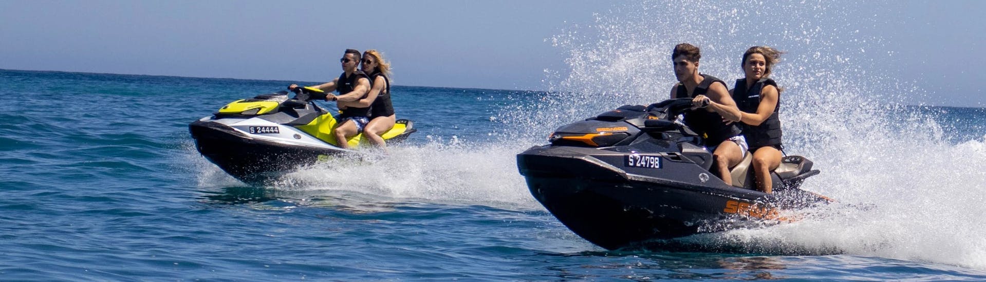 A group does a Jet Ski Safari from St Thomas Bay to the Blue Grotto & St. Peter's Poolwith SIPS Watersports Malta.
