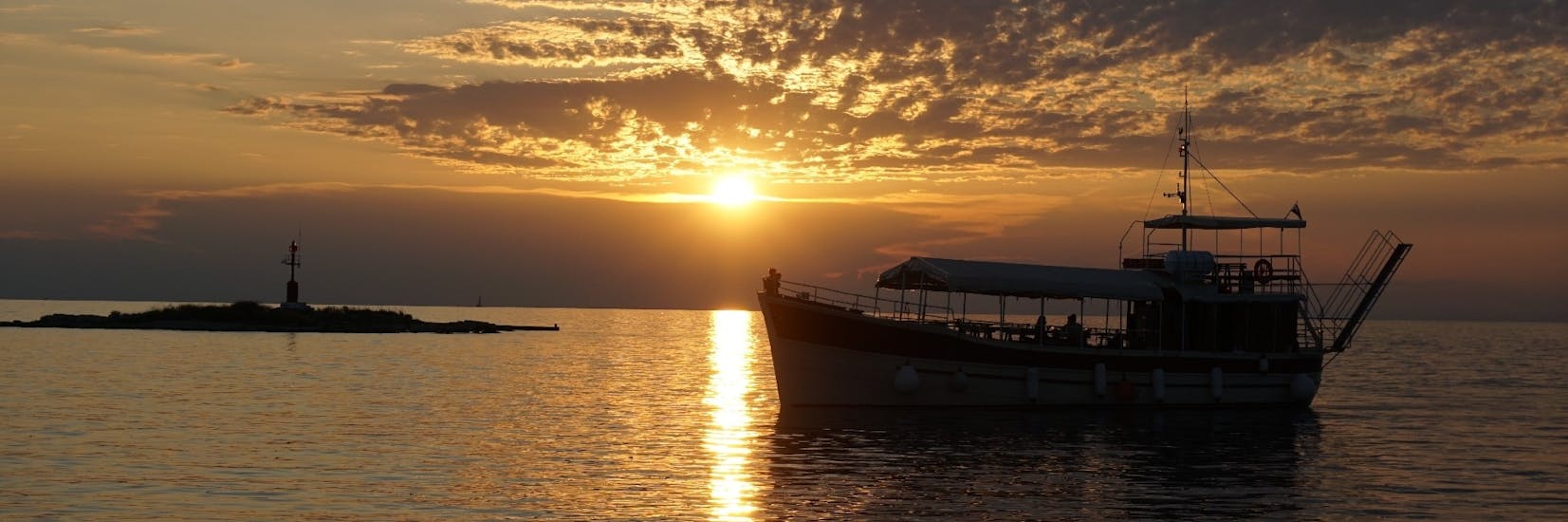 Gita in barca da Parenzo (Poreč) a Parenzo (Poreč) al tramonto e visita turistica.