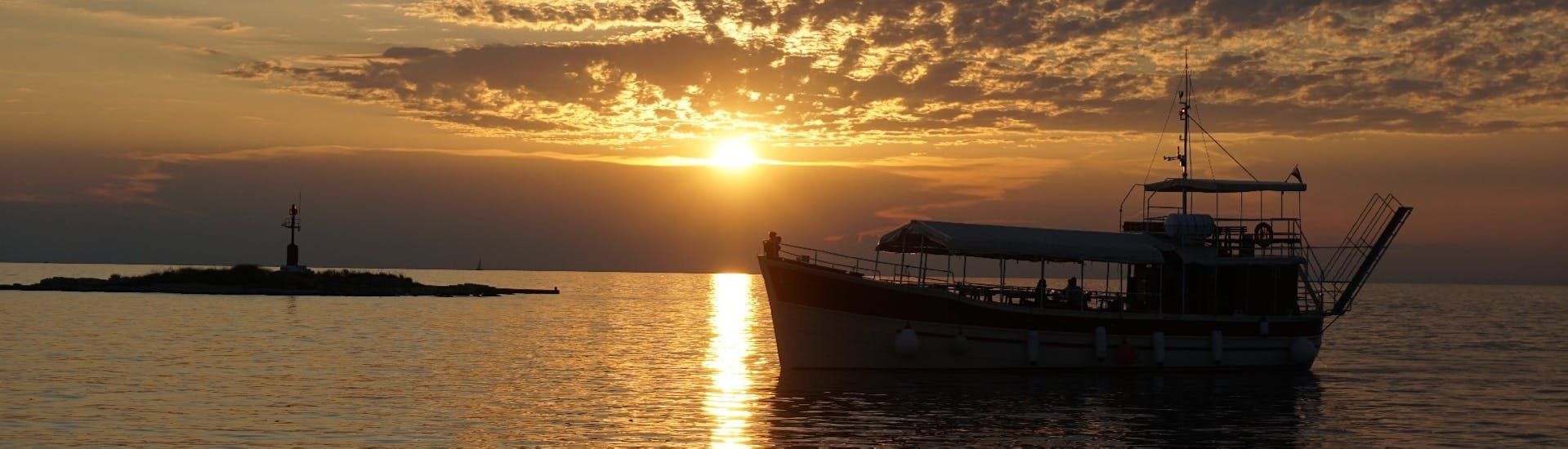 Gita in barca da Parenzo (Poreč) a Parenzo (Poreč) al tramonto e visita turistica.