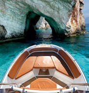 A picture of a luxurious motor boat during the Private Boat Trip to Turtle Island and Keri Caves with Snorkeling from Mistral Rentals Zakynthos.