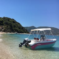 A licence free self drive boat in the blue water from Boat Rental from Laganas Beach to Marathonisi and Keri Caves (up to 6 people) from Mistral Rentals Zakynthos.