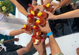 Friends Holding a Local Vermut in Sailing Boat Trip in Barcelona from Cat Vents Barcelona.
