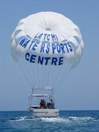 A parasailing activity takes place in Anassa Beach in Cyprus from Latchi Dive & Watersports Centre.