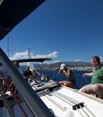 People relaxing on the boat during the Full Day Sailing Trip to South Crete with Lunch and Snorkeling Included from Altersail Heraklion.
