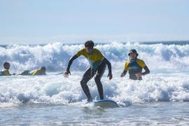 Person catching a wave during Private Surf Lesson (from 6 y.) in Costa da Caparica from Portugal Surf School Costa da Caparica.