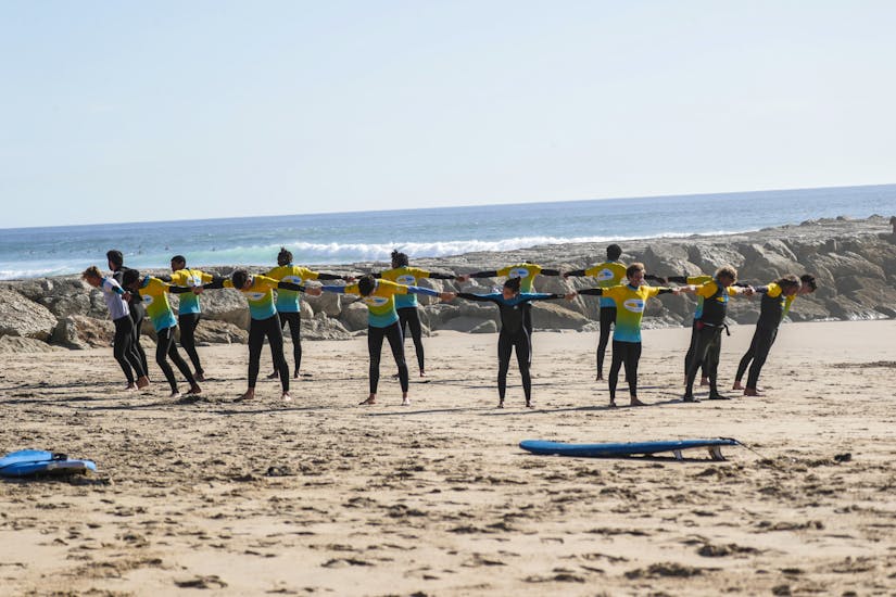 Warm-up exercise at Surf Lessons (from 6 y.) in Costa da Caparica.