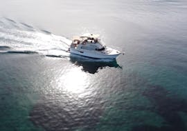 A boat is driving to its next destination while Boat Trip from Malia to Stalis & Hersonissos with Swimming Stops & Snorkeling organized by Malia Cruises.