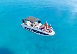A group of people on a speedboat doing the Boat Trip to Golden Horn, Bol Town & Hidden Bays of Brač Island from Promare Boat Charter Makarska.