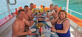 People Eating Fish during Traditional Fishing Tour with Breakfast & Lunch from Dali Tours Zakynthos.