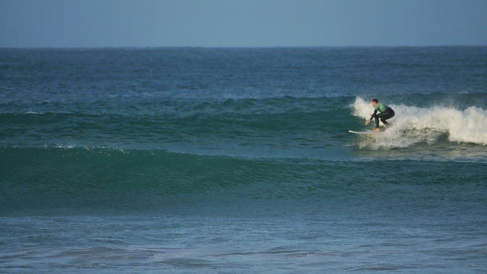 A kid taking a wave thanks to a g3 Private Surf Lesson at Peniche (from 8 y.) - All inclusive.