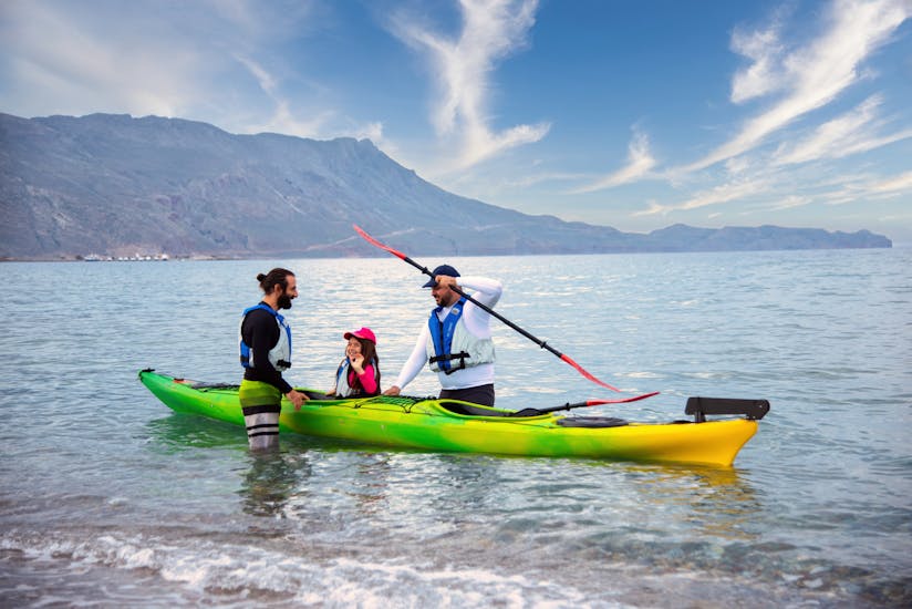 A family in the water on the kayak during the Sea Kayak Tour around Kissamos Bay for Families.