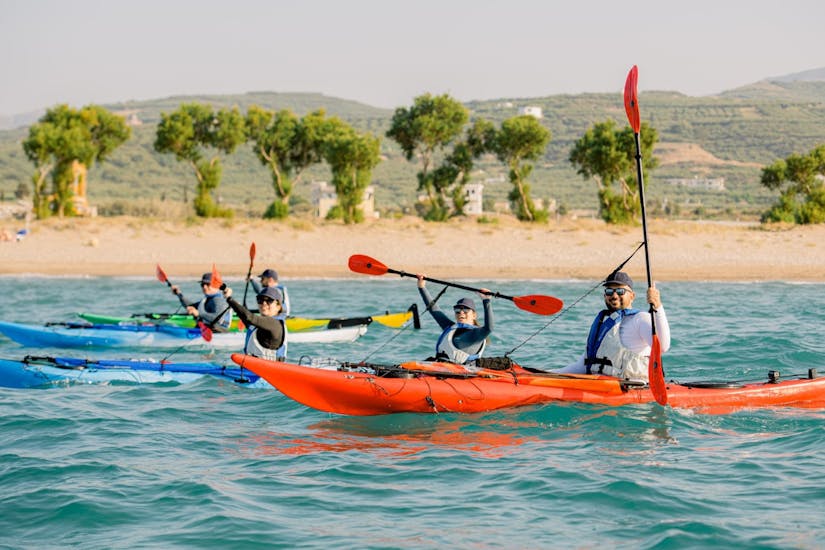 A group of kayakers enjoying their Sea Kayak Tour in Falassarna with Swimming.