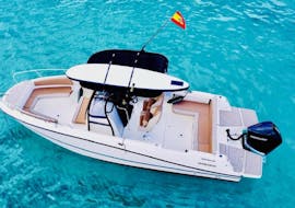 Top view of Emilia private boat within the clear waters of Mallorca with MiniBar&co