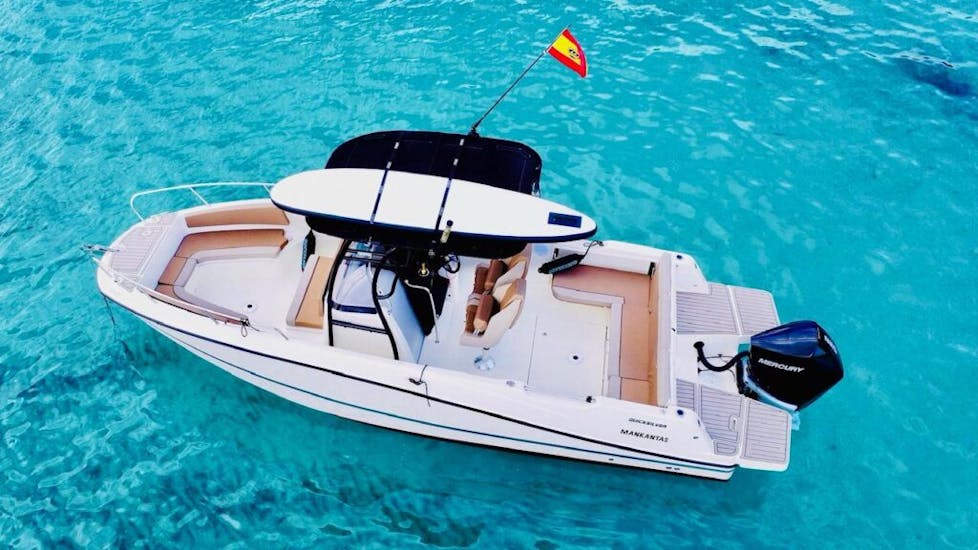 Top view of private boat within the clear waters of Mallorca with MiniBar&co