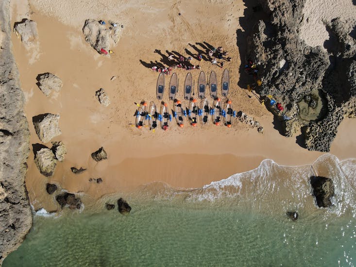 Group of people who participate in a sea kayak tour next to the beach organized by Clear Emotions Benagil.