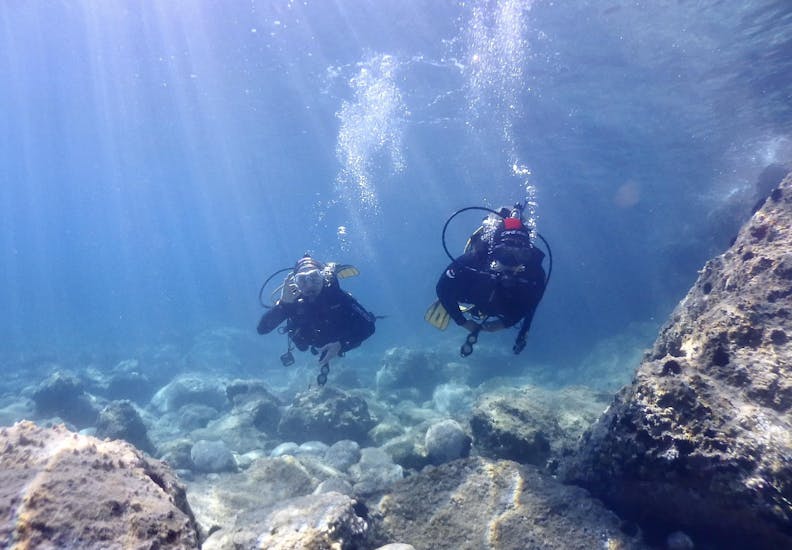 Two divers who are exploring in their buddy team during the 2 Guided Shore Dives in Halkidiki for Certified Divers from Dive Greece Halkidiki.