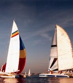 Two catamaran racing during the 80s. One of them is the Half-Day Catamaran-Trip on Grau-du-Roi Coasts skipper from Voilemed.