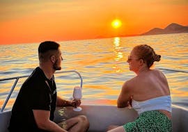 A couple in Front of the sunset during their Private Sunset Boat Trip in Dubrovnik from Dubrovnik Coastal Beauty.
