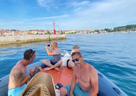 People enjoying the view on Rovinj during the Private Boat Trip around the Lim Fjord and Rovinj with Swimming and Snorkeling from Istra Speed Boat.