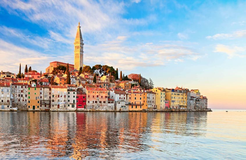 The coastline from Rovinj with a church and colourful houses during the Private Boat Trip from Vrsar to Rovinj from Istra Speed Boat.
