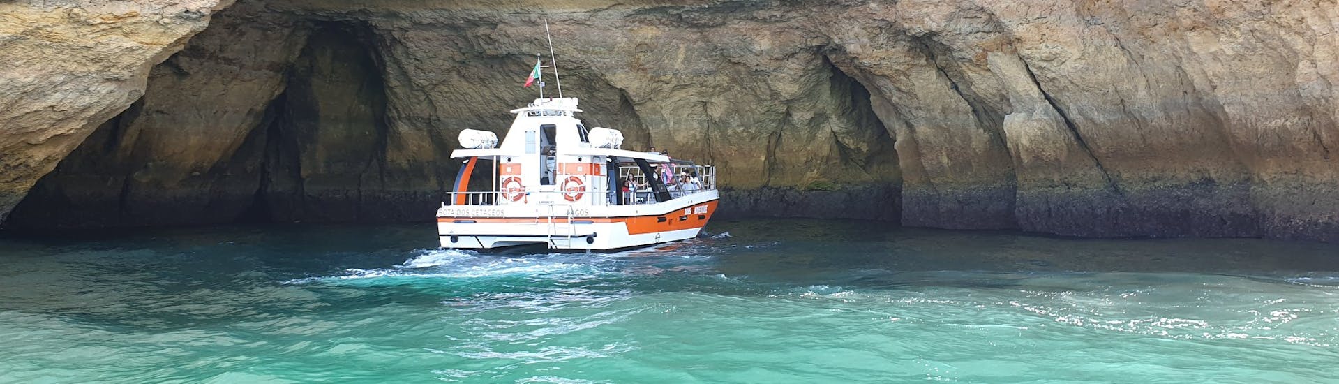 The catamaran in a cave during the Catamaran Trip to the Benagil Caves with Swimming.