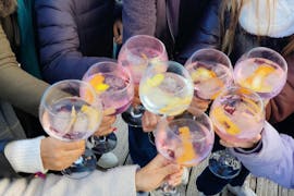Group of friends holding GinTonic glasses during their activity with BDA Experiences.
