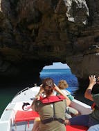 Boat going through a cave during the Boat Trip to Local Caves in Salema from Salema Tours.
